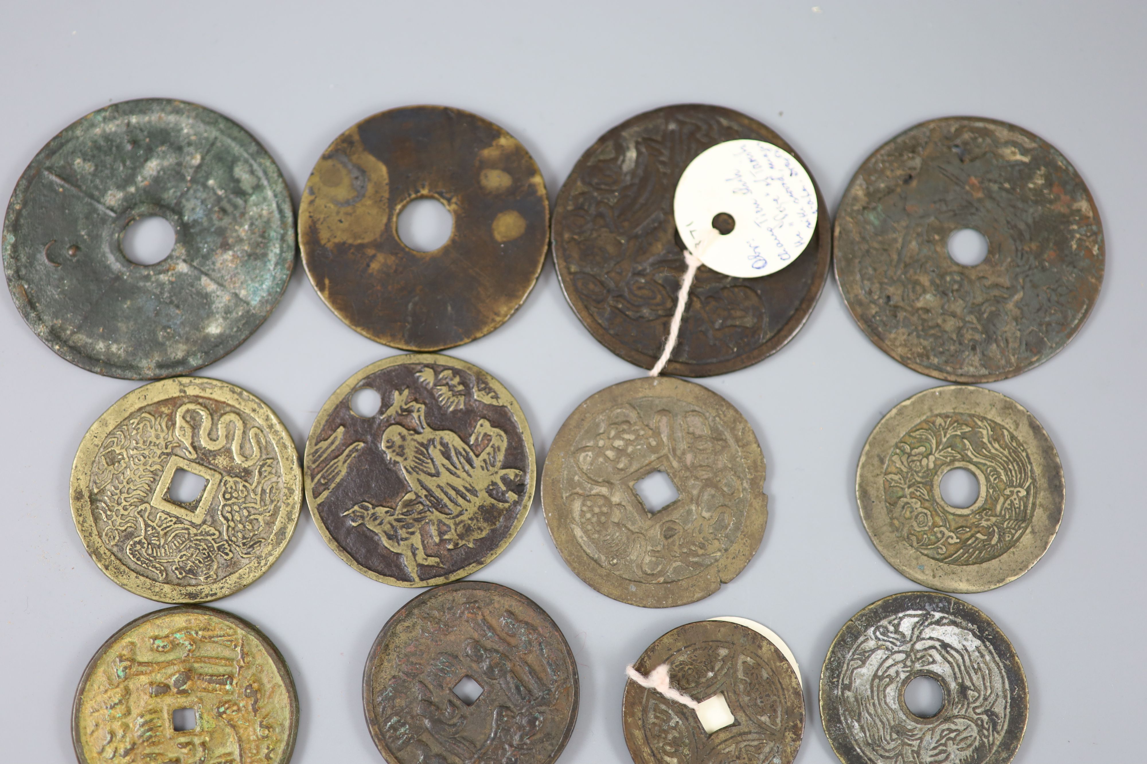 China, 17 bronze or copper charms or amulets, Qing dynasty or earlier,